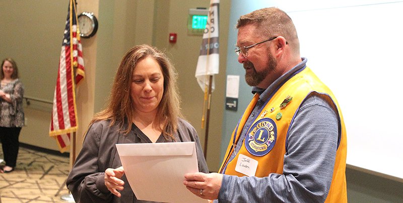 The Sentinel-Record/Richard Rasmussen SCHOLARSHIP: Jeff Louden, right, presents NPC nursing and health sciences student Tammy Hardin with a South Hot Springs Lions Club Scholarship Thursday during NPC's Nursing and Health Sciences Honors Day ceremony at the school.