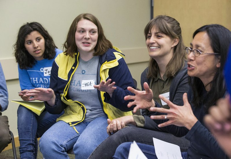 NWA Democrat-Gazette/BEN GOFF &#8226; @NWABENGOFF Joy Janicke (from left), Sara Orr, both Thaden School sophomores, Monica Diodati and Hoa Nguyen take part in a discussion Thursday during a community dialogue between Bentonville residents moderated by Thaden School sophomores at the Bentonville Public Library.