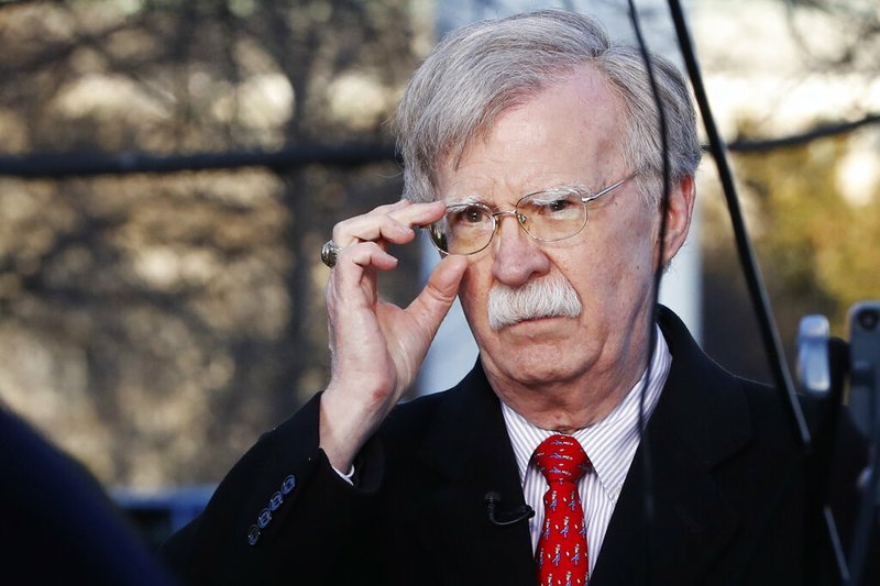 In this March 5, 2019, file photo, U.S. national security adviser John Bolton adjusts his glasses before an interview at the White House in Washington. North Korea has issued a relatively mild criticism of White House national security adviser John Bolton over a recent interview he gave.  (AP Photo/Jacquelyn Martin, File)