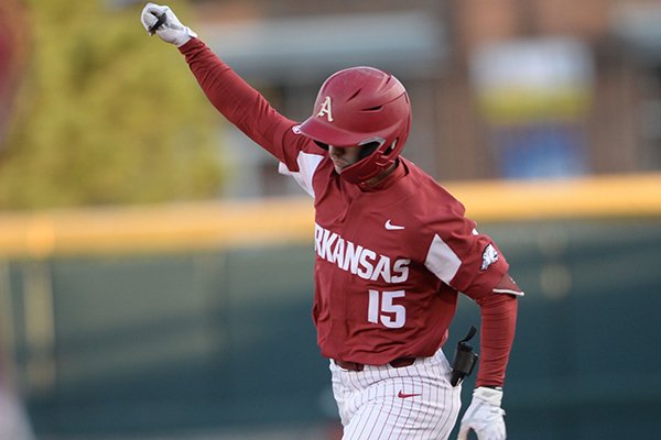 Arkansas shortstop Casey Martin celebrates after hitting a grand slam during a game against Mississippi State on Friday, April 19, 2019, in Fayetteville. 