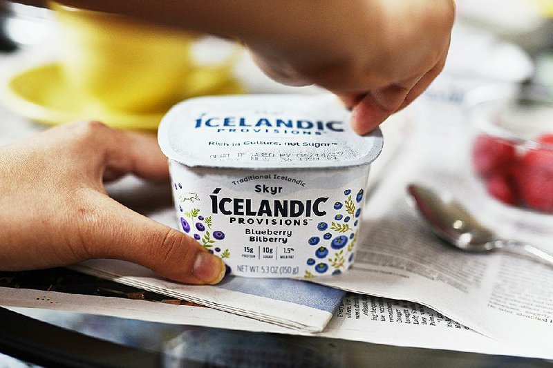 A container of Icelandic Provisions Skyr blueberry yogurt is arranged for a photograph in the Brooklyn Borough of New York, in late March. 