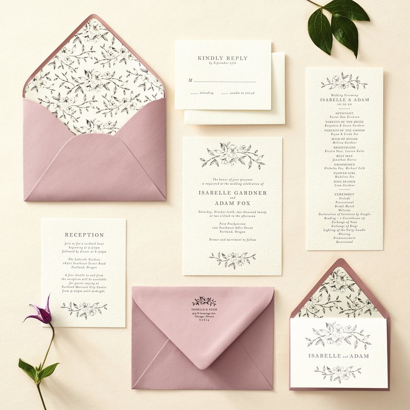 This photo provided by Paper Source shows the exclusively designed Dogwood Blossom Wedding Invitation suite from Paper Source's 2019 collection. Whether formal or casual, wedding invitations these days are meant to set the tone for the celebration and reflect its themes. Whether formal or casual, wedding invitations these days are meant to set the tone for the celebration and reflect its themes. (Paper Source via AP)