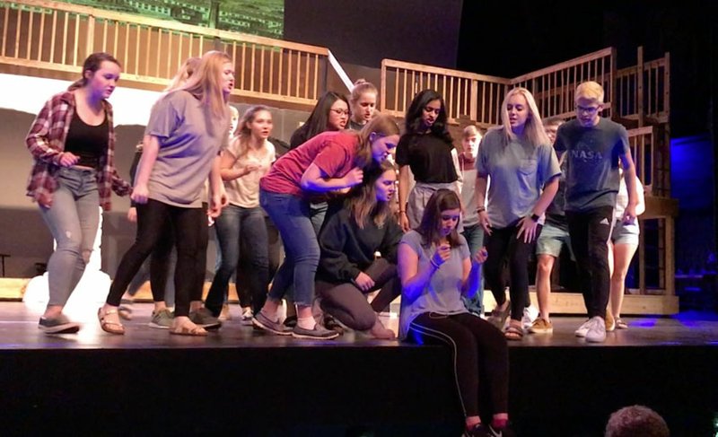 NWA Democrat-Gazette/BECCA MARTIN-BROWN Maren Bayles as Fantine is surrounded by members of the chorus of the BHS production of "Les Miserables."