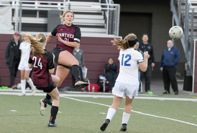 Bud Sullins/Special to Siloam Sunday Siloam Springs senior Hailey Dorsey, middle, sends a ball back into the attack as sophomore Sydney Moorman, left, and Greenbrier's Jayden Glover also make a play on the ball during Thursday's game at Panther Stadium. Siloam Springs defeated Greenbrier 2-0 to improve to 9-1 in 5A-West Conference play.