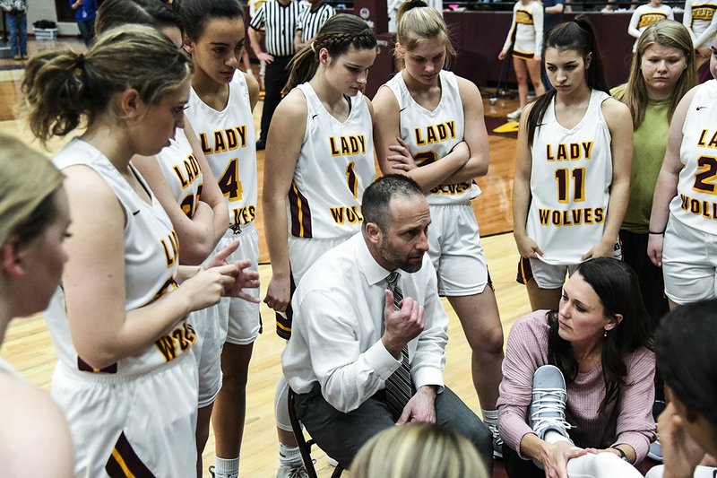 The Sentinel-Record/Grace Brown- Lake Hamilton head coach Blake Condley talks with members of his team during a timeout in its first round of the 5A state tournament against Paragould Tuesday, February 26, 2019, at Wolf Arena.