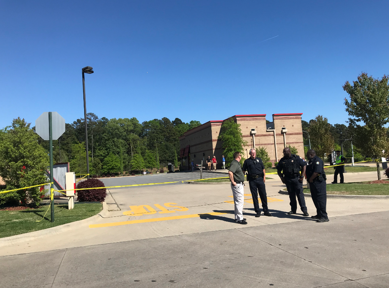 FILE — Authorities investigate an officer-involved shooting in the area of a west Little Rock shopping center.