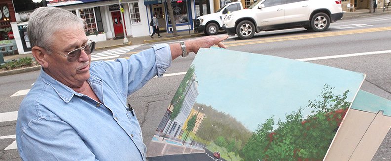 Downtown business owner Rik Gale talks about his ideas for the fountain area at the north end of Central Ave., Wednesday, April 17, 2019. 