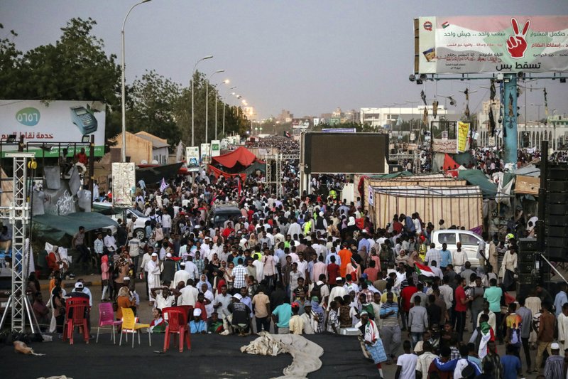 Sudanese protesters chant slogans during a rally outside the army headquarters in Sudan's capital Khartoum on Saturday, April 20, 2019. Sudan's military ousted President Omar al-Bashir following four months of street protests against his rule, then appointed a military council it says will rule for no more than two years while elections are organized. Protesters fear the army, dominated by al-Bashir appointees, will cling to power or select one of its own to succeed him.(AP Photo)