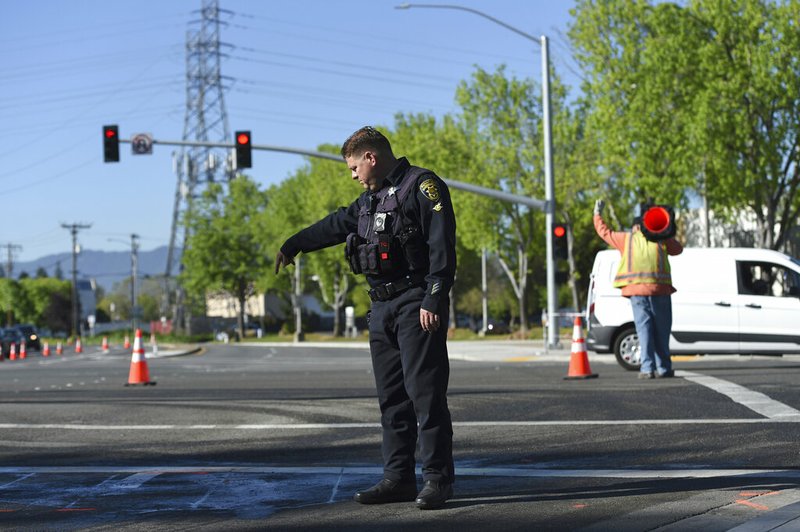 Police and road crews work the scene after a car crash at the intersection of El Camino Real and Sunnyvale Road in Sunnyvale, Calif., on Wednesday, April 24, 2019. Investigators are working to determine the cause of the crash in Northern California that injured several pedestrians on Tuesday evening. Authorities say the driver of the car was taken into custody after he appeared to deliberately plow into the group. (AP Photo/Cody Glenn)