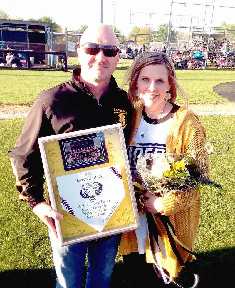 MARK HUMPHREY ENTERPRISE-LEADER/Prairie Grove athletic director Joey Sorters and his wife Donna, parents of the late Jarren Sorters who would have been a senior this year, were included in Friday's senior night celebration.