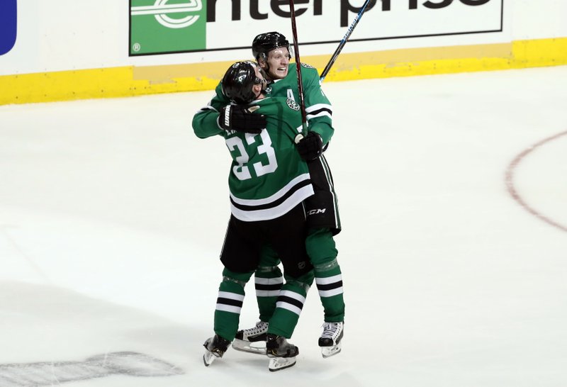 The Associated Press STARS SEAL SERIES: Dallas Stars' Esa Lindell (23) celebrates with John Klingberg after Klingberg scored in overtime against the Nashville Predators in Game 6 of Monday's playoff game in Dallas. The Stars won 2-1 in overtime.