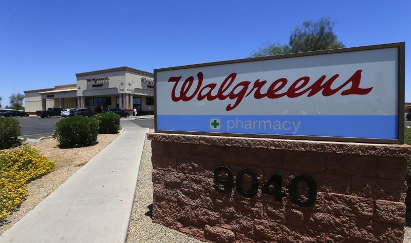 In this June 25, 2018, file photo shows a Walgreens store in Peoria, Ariz. Walgreens said Tuesday, Sept. 23, 2019, that it has decided to raise its minimum age for tobacco sales several weeks after a top federal official chastised the drugstore chain for violating laws restricting access to cigarettes and other products. (AP Photo/Ross D. Franklin, File)