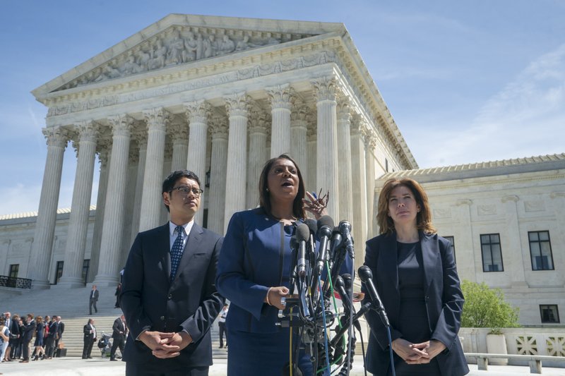 New York State Attorney General Letitia James, center, flanked by Dale Ho, left, an attorney for the American Civil Liberties Union, and New York City Census Director Julie Menin, speaks to reporters after the Supreme Court heard arguments over the Trump administration's plan to ask about citizenship on the 2020 census, in Washington, Tuesday, April 23, 2019. Critics say adding the question would discourage many immigrants from being counted, leading to an inaccurate count.