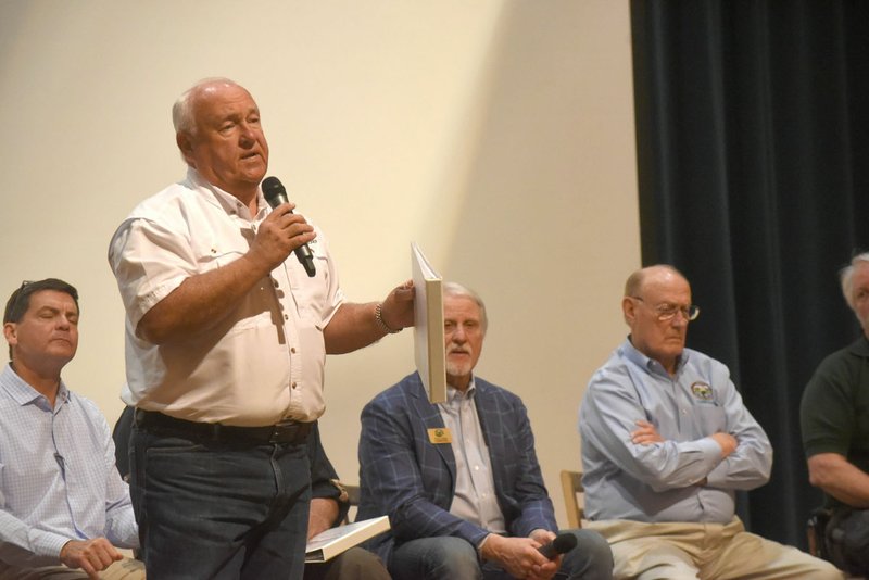 Bobby Martin of Rogers, on the Arkansas Game and Fish Commission panel of commissioners, responds to a question Tuesday night at the Jones Center in Springdale.