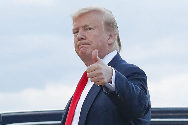 In this April 21, 2019 photo, President Donald Trump gives a 'thumbs-up' as he walks across the tarmac during his arrival on Air Force One at Andrews Air Force Base, Md. (AP Photo/Pablo Martinez Monsivais)