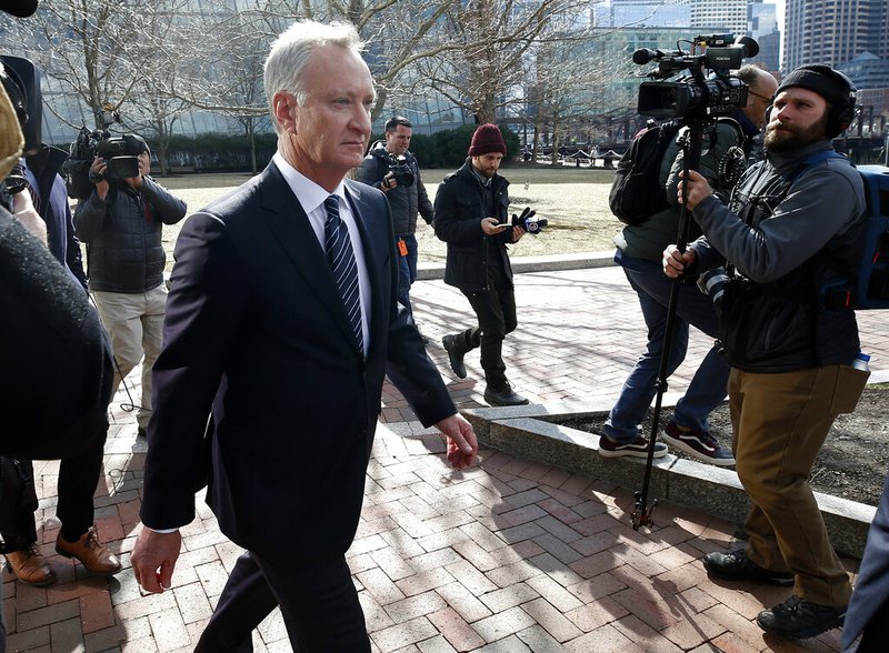 In this April 3, 2019 file photo, TobyMacFarlane departs federal court in Boston after facing charges in a nationwide college admissions bribery scandal. Authorities said Tuesday, April 23, that MacFarlane, a former senior executive at a title insurance company, will plead guilty to racketeering conspiracy and cooperate with federal authorities in the case. (AP Photos/Michael Dwyer, File)