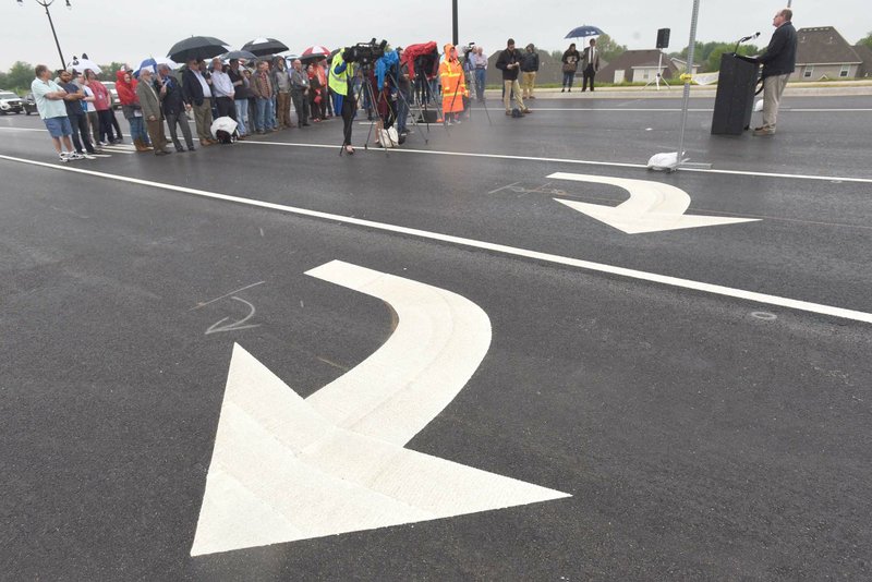 Attendees hear remarks Wednesday April 24 2019 at the dedication of the Interstate 49 and Eighth Street interchange in Bentonville. The interchange is expected to open to traffic sometime in May.