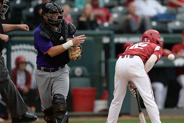 Arkansas catcher Casey Opitz (right) reacts after striking out with a runner in scoring position Wednesday, April 24, 2019, to end the seventh inning against Northwestern State at Baum-Walker Stadium in Fayetteville. 