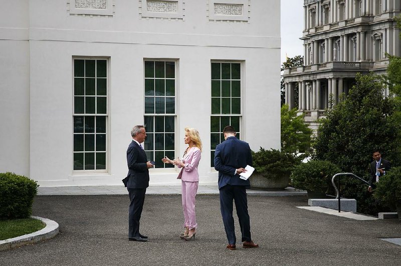 White House counselor Kellyanne Conway conducts an interview Wednesday with a television crew on the grounds of the White House. Conway echoed President Donald Trump’s comments on what he called unnecessary House inquiries, calling the Russia investigation report “the nonpartisan, definitive, conclusive taxpayer-funded, lengthy, unobstructed, unimpeded, uninterfered with investigation.” 