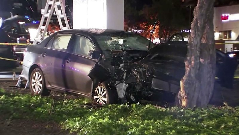 This image taken from video provided by KGO-TV shows the car that police say struck several pedestrians Tuesday in Sunnyvale, Calif., before crashing into a tree.