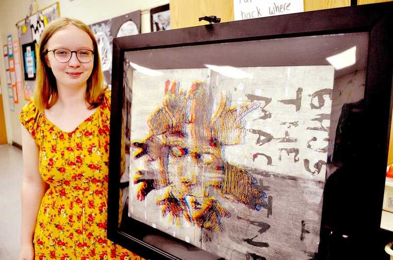RACHEL DICKERSON/MCDONALD COUNTY PRESS McDonald County High School junior Makayla Stone is pictured with her artwork for which she won a gold key rating in the National Scholastic Art and Writing Contest.