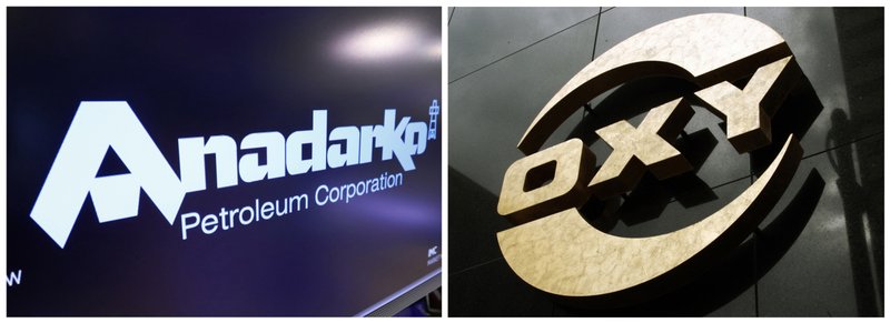 This combo of file photos shows the logo for Anadarko Petroleum Corp. on the floor of the New York Stock Exchange on April 12, 2019, left, and a logo on the Occidental Petroleum building in Los Angeles on Jan. 26, 2010. A bidding war is breaking out over Anadarko Petroleum, with Occidental making an offer worth $76 per share in cash and stock that it says is about a 20% premium to Chevron's $33 billion deal. (AP Photos)