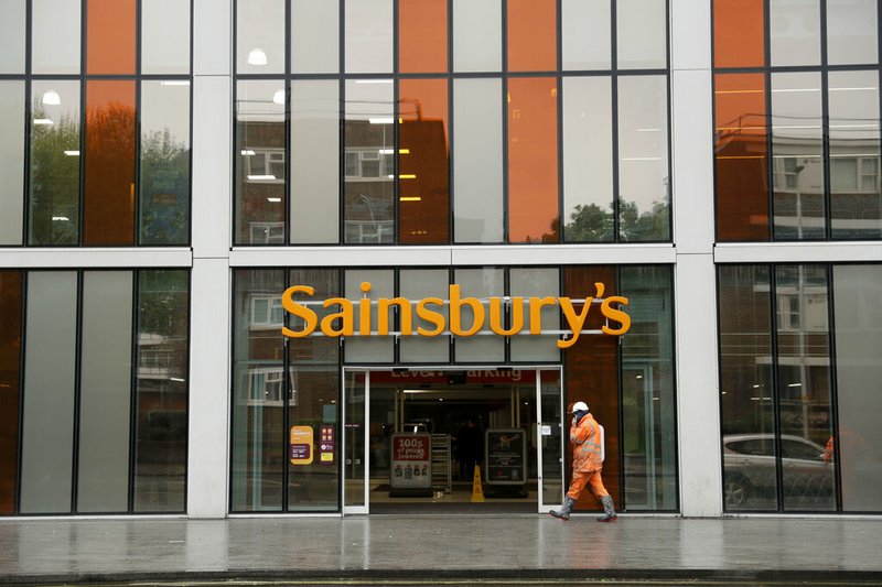 This April 30, 2018, file photo shows an exterior view of the Sainsbury's flagship store in the Nine Elms area of London. British competition regulators have blocked J. Sainsbury Plc's 7.3 billion-pound ($9.4 billion) purchase of Walmart's Asda unit, which would have created the U.K.'s biggest supermarket chain. The Competition and Markets Authority says the deal would have increased prices and reduced the quality and range of products available to shoppers, it was reported on Thursday, April 25, 2019. (AP Photo/Matt Dunham, File)