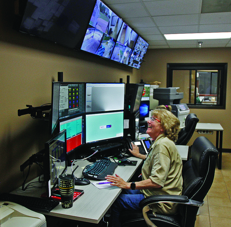 Dispatch: 911 Dispatchers Sally Pittser (foreground) and Krystal Cooper sit in their new dispatch office. From there, they are able to view live camera feeds showing activity throughout the entire Union County Sheriff’s Office facility; they also take 911 calls and dispatch officers based on their location. Terrance Armstard/News-Times