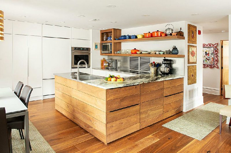 In downsizing, the author’s friend Cathy Barrow reduced the extent of her kitchen belongings by half. She and her contractor and Ikea managed to create a functional yet tidy footprint based on what had been kept.