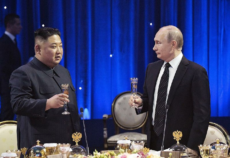 North Korean leader Kim Jong Un and Russian President Vladimir Putin share a toast Thursday after their talks in Vladivostok, Russia. On sharing the substance of the talks with President Donald Trump, Putin said: “There are no secrets. Russia’s position always has been transparent. There are no plots of any kind.”