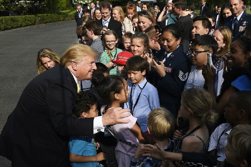 President Donald Trump meets with children Thursday as part of Take Our Daughters and Sons to Work Day at the White House. Earlier he tweeted about former aide Donald McGahn, writing that if he’d wanted Robert Mueller fired, “I didn’t need McGahn to do it.”