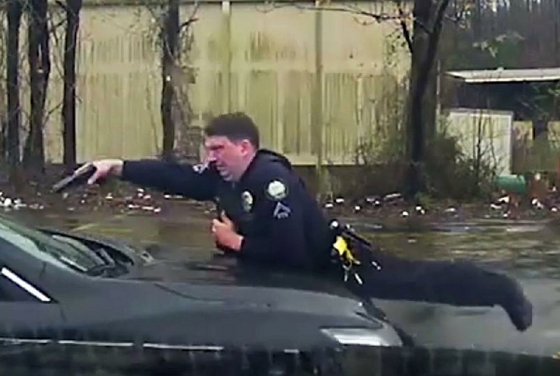 Officer Charles Starks of the Little Rock police is shown firing into the vehicle driven by Bradley Blackshire, first from the side and then from the front, in this Feb. 22 police dashboard camera video. The video shows Starks confronting Blackshire, ordering him multiple times to get out of the car. Then the car rolls forward, striking Starks.