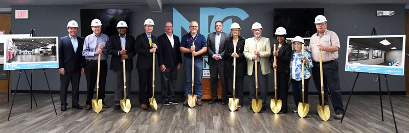 The Sentinel-Record/Grace Brown DIGGING IN: The National Park College Board of Trustees and representatives from the school's Marine Technology program conduct a mock groundbreaking for the school's new Marine Technology building at the campus on Wednesday.