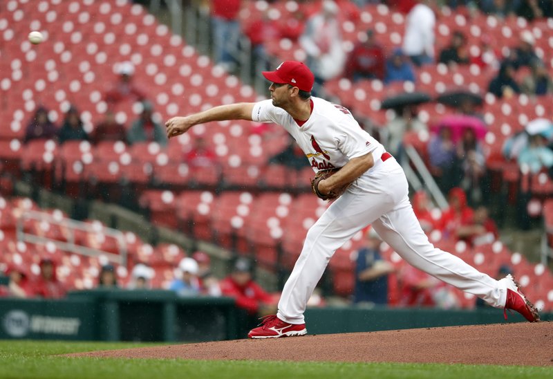 The Associated Press WIN NO. 150: vSt. Louis Cardinals starting pitcher Adam Wainwright throws during the first inning of Wednesday's game against the Milwaukee Brewers in St. Louis.