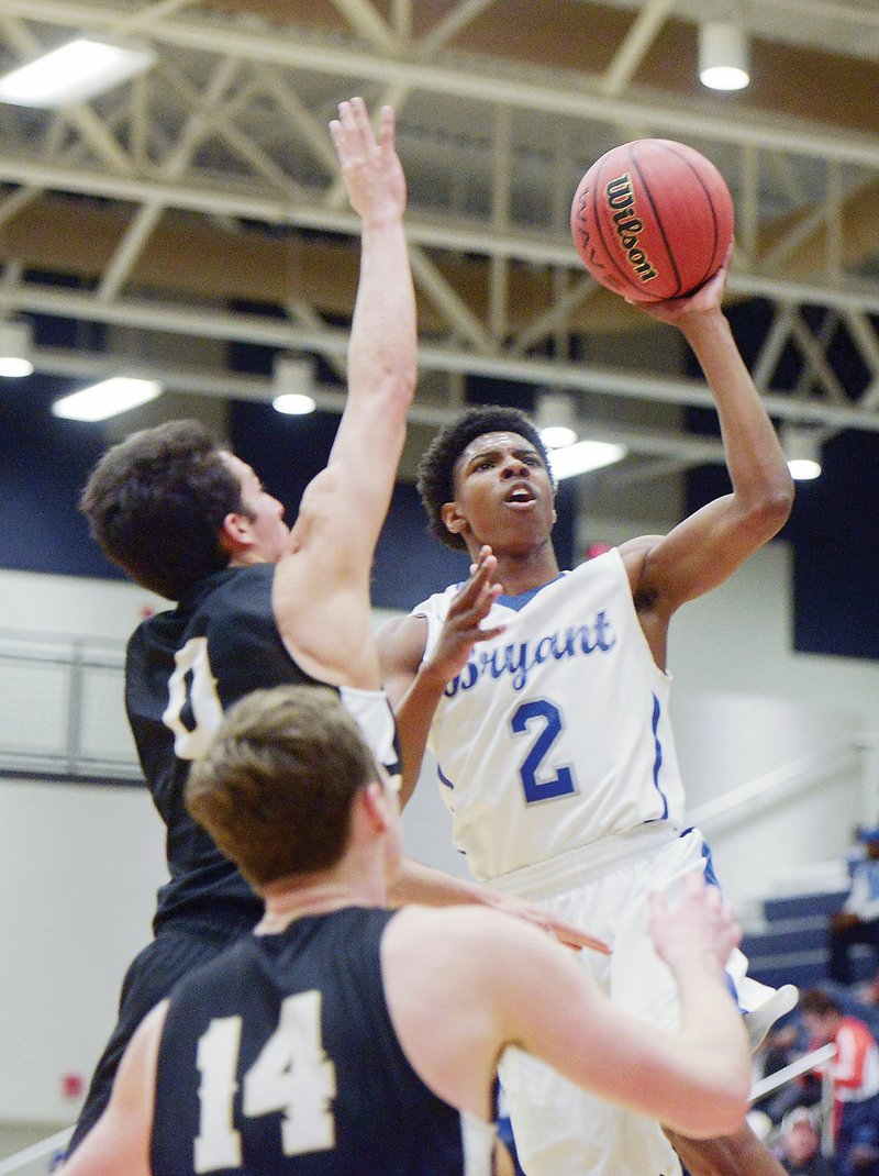 Bryant junior Khalen Robinson, No. 2, shoots over Bentonville’s Thane Spencer, No. 0, and Brayden Freeman, No. 14, during the semifinals of the Class 6A State Tournament. Robinson is the Tri-Lakes Edition Boys Player of the Year.