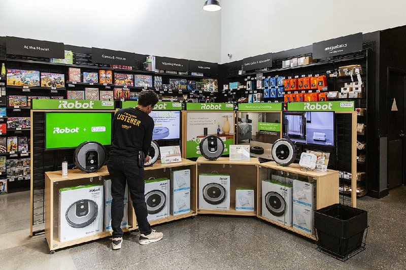 IRobot Corp. Roombas are displayed at an Amazon store in Berkeley, Calif. Amazon has found that two-day delivery is no longer a big draw for customers as other retailers close the gap on the offer of convenience. 