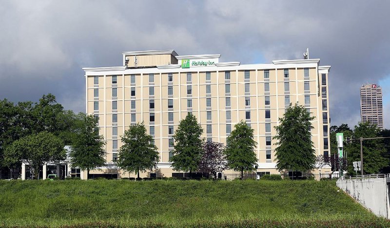 New owners paid $12.3 million last month for the Holiday Inn Presidential hotel at 600 Interstate 30. 