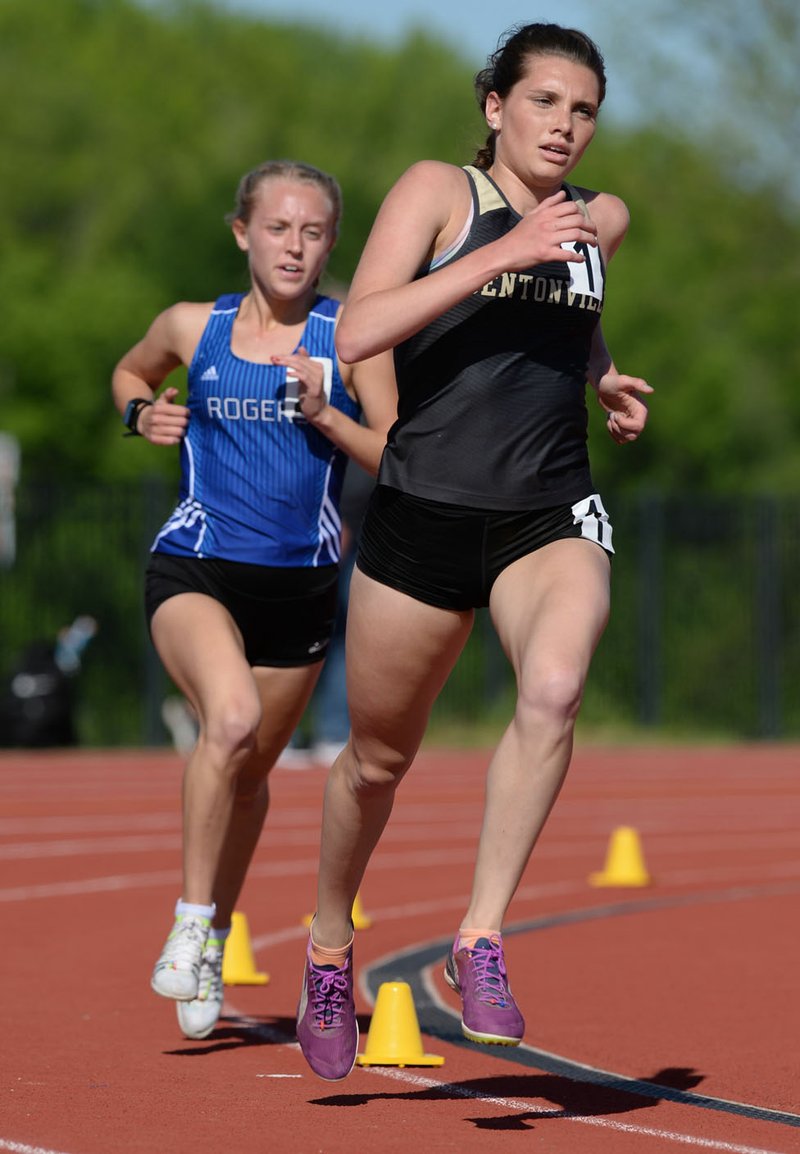 NWA Democrat-Gazette/ANDY SHUPE Bentonville's Lainey Quandt (right) leads Rogers' Anna Jeffcoat Friday, April 26, 2019, in the 1,600 meters during the 6A-West Conference Outdoor Track and Field Meet at Van Buren High School. Visit nwadg.com/photos to see more photographs from the meet.