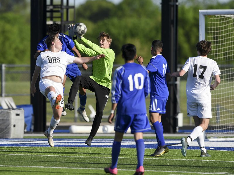 NWA Democrat-Gazette/CHARLIE KAIJO Bentonville High School Evan Shanks (1) blocks a shot during a soccer game, Friday, April 26, 2019 at Whitey Smith Stadium at Rogers High School in Rogers.
