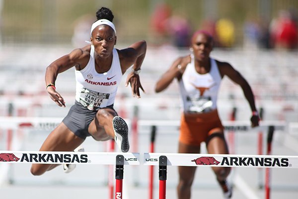 Arkansas' Janeek Brown runs the 100 hurdles during the National Relay Championships on Friday, April 26, 2019, at John McDonnell Field in Fayetteville.