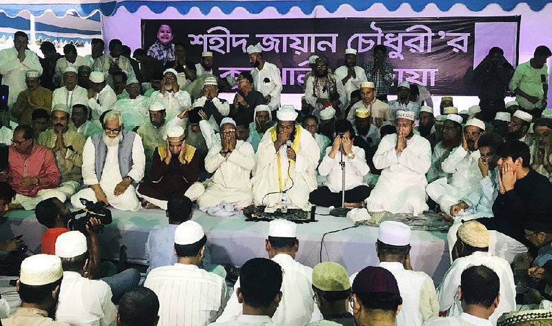 Bangladeshis seek blessings for 8-year-old Zayan Chowdhury during a Saturday prayer session in Dhaka. More than 1,000 people gathered in Bangladesh’s capital to remember the boy, who was killed in one of the Easter bombings in Sri Lanka. 