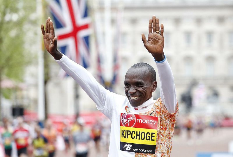 Kenya’s Eliud Kipchoge celebrates after winning the London Marathon. 