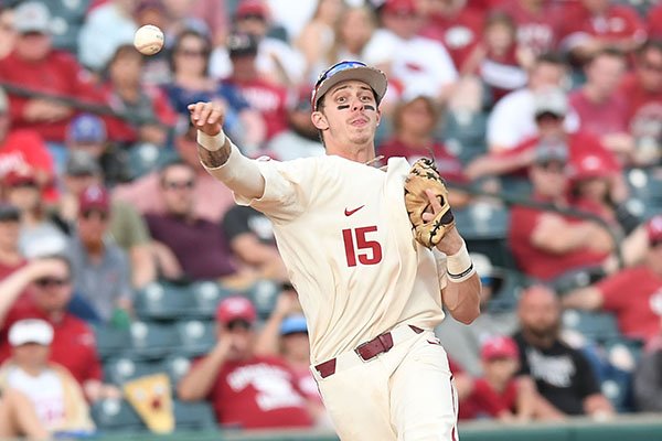 Arkansas shortstop Casey Martin throws out a runner during a game against Tennessee on Sunday, April 28, 2019, in Fayetteville. 