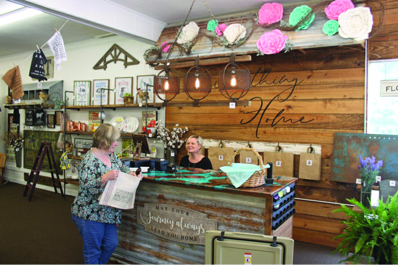 Décor: A customer checks out at Everything Home’s grand opening Monday.