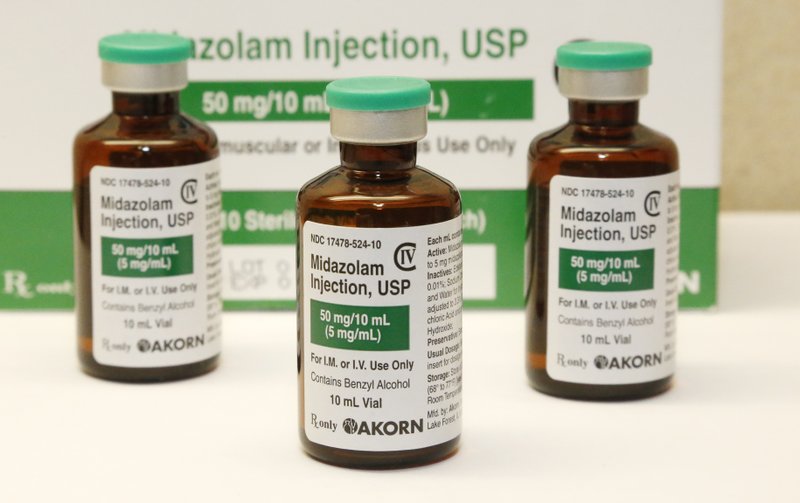 File - This July 25, 2014 file photo shows bottles of the sedative midazolam at a hospital pharmacy in Oklahoma City. The Arkansas Supreme Court ruled Thursday, June 23, 2016, that the state can execute eight death row inmates using its three-drug protocol, upholding a state law that keeps information about lethal injection drugs confidential. (AP Photo/File)