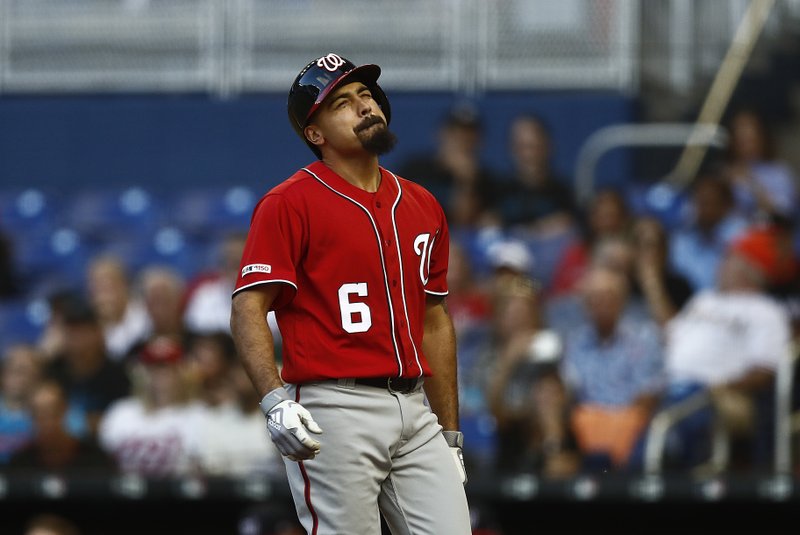 Washington Nationals' Anthony Rendon (6) reacts to being hit by the ball by Miami Marlins starting pitcher Jose Urena (62) during the third inning of a baseball game against the on Saturday, April 20, 2019, in Miami. (AP Photo/Brynn Anderson)