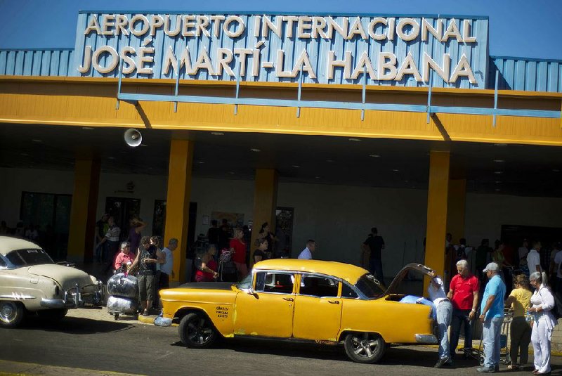 People arrive from the U.S. in 2014 at Havana’s Jose Marti International Airport, which once was owned by the father of a Cuban exile.