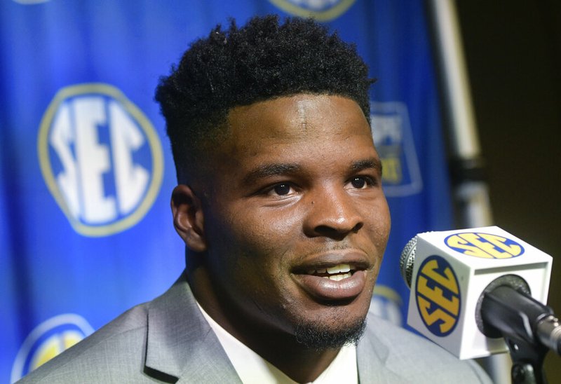 In this July 17, 2018, file photo, Arkansas linebacker Dre Greenlaw is interviewed during the Southeastern Conference football media days at the College Football Hall of Fame in Atlanta. San Francisco 49ers rookie Greenlaw enters the NFL with a little more fanfare than most fifth-round linebackers. His role as a good Samaritan to save a high school classmate from a potential date rape encounter at a college fraternity party was publicized on social media by the woman's father shortly after he was drafted by the 49ers last Saturday. (AP Photo/John Amis, File)