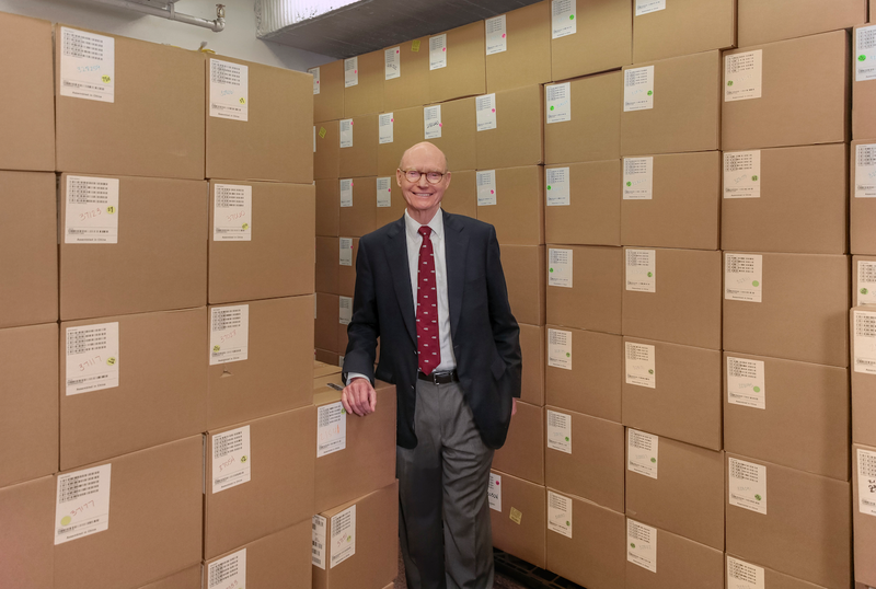 Walter Hussman, publisher of the Democrat-Gazette, recently stands in front of boxes containing thousands of iPads. (Arkansas Democrat-Gazette/JOHN SYKES JR.)
