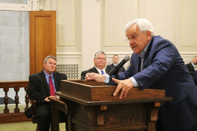 Former Sen. Eddie Joe Williams, R-Cabot, speaks at the state Capitol on Tuesday as attendants including Dr. Sonny Tucker (far left), executive director of the Arkansas Baptist State Convention, look on. The convention has partnered with the Department of Correction and Mid-America Baptist Theological Seminary in Cordova, Tenn., to create an on-site seminary program at the Varner Unit that offers inmates the opportunity to earn a degree in Christian studies. 